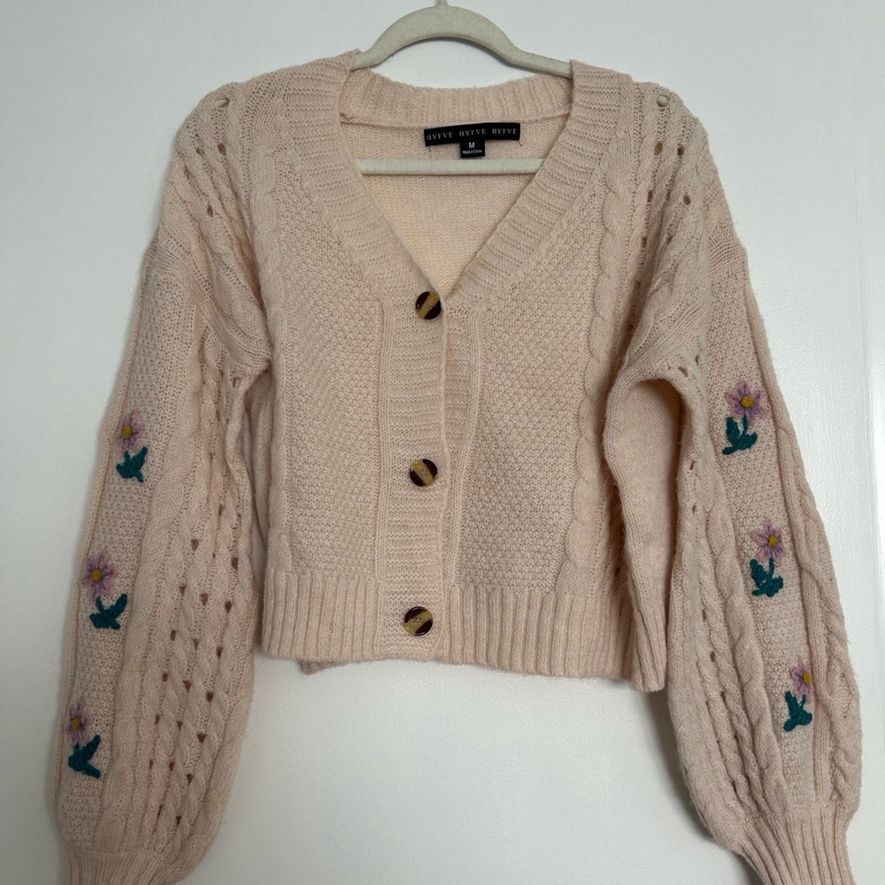 Light pink sweater with floral stitching